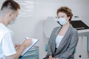 Healthcare provider talking with a patient during a consultation